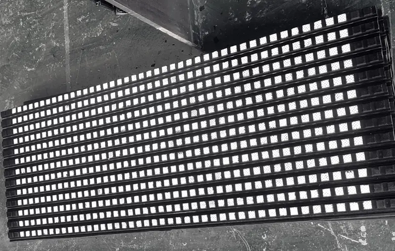 Ceramic lagging sheet: dimpled square alumina tiles in ribbed rubber