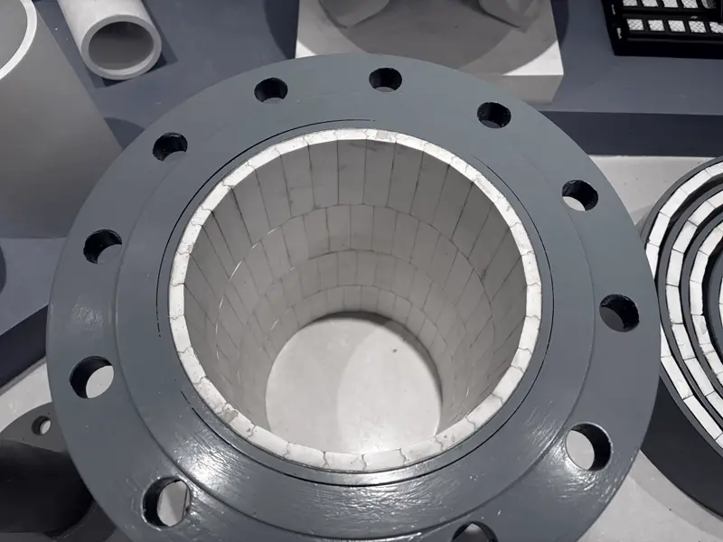 Looking into an alumina tile-lined steel spool